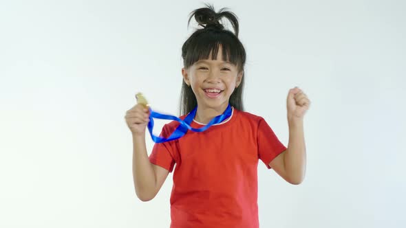 Little Girl Happy With Golden Medal