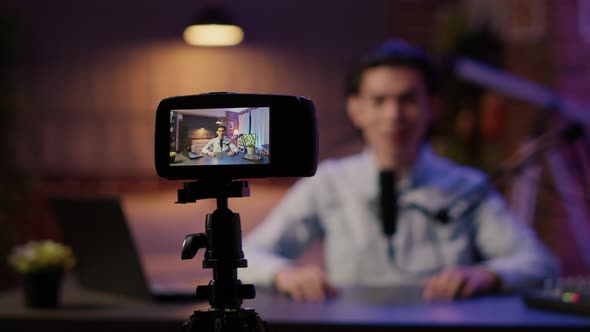 Camera on Tripod Recording Influencer Talking to Audience