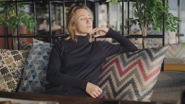 Portrait of an Attractive Woman in a Restaurant