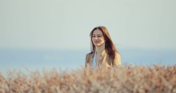 Happy Business Lady Goes Along Bush Plantings