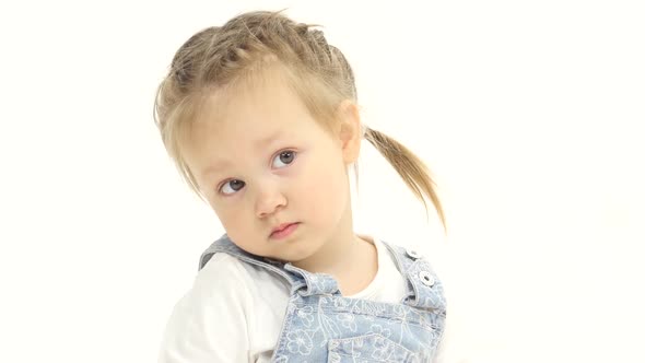 Child Looks Around Trying To Find His Mother. White Background