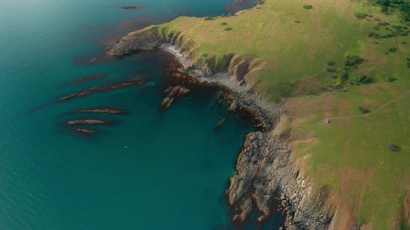 Drone flight around a picturesque rocky coastline