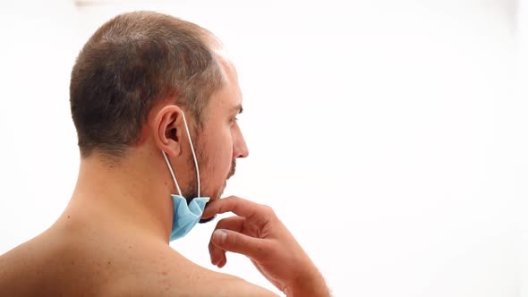 Man Naked in a Medical Mask