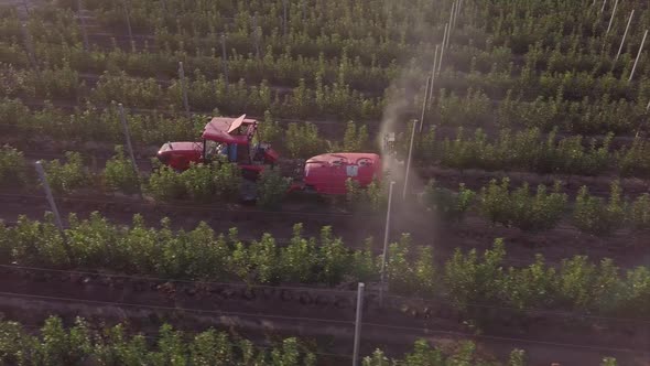 Aerial View of the Sprayer for Applying Fungicides in the Apple Orchard