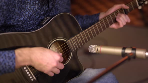 Closeup Playing the Guitar Frame of Hands Playing the Strings