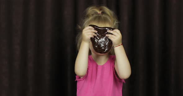 Child Having Fun Making Brown Slime. Kid Playing with Hand Made Toy Slime