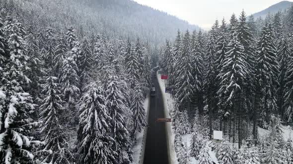 Aerial View of Snowed Winter Road in Carpathian Mountains