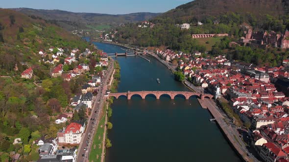 Pedestrian bridge over the river. Beautiful top view of the Heidelberg castle.