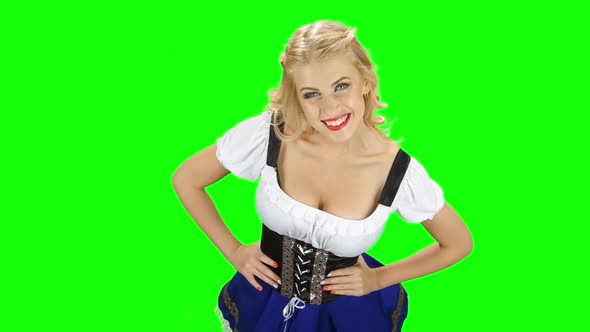 Bavarian Girl in the Room Spinning Around Herself and Smiles. Green Screen