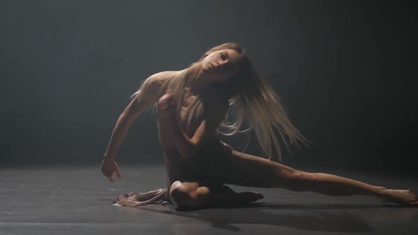 Close-up Slow Motion, Graceful Lady Practicing Contemp in Dark Studio.