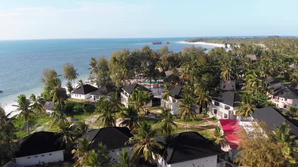 Paradise Coast Resort with Palm Trees and Hotels By Ocean Zanzibar Aerial View