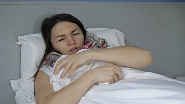 Sick Young Woman Wrapped Herself in a Blanket