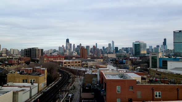 Chicago, Illinois City Buildings Skyline with Train Tracks Aerial Flight