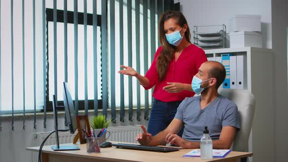 Workers Talking Wearing Face Masks