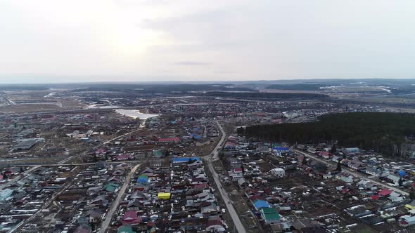Aerial view of large village at spring, a cloudy day 01