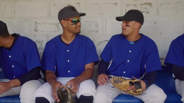 Baseball players discussing together