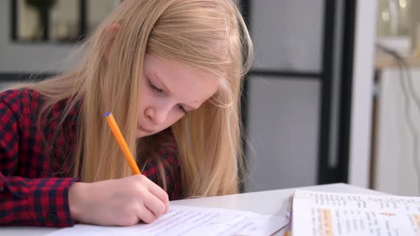 Blonde Schoolgirl Studying at Home Doing School Homework