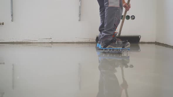 The Process of Laying the Self-leveling Floor. Compaction of Dry Cement-sand Mixture. Liquid Floor