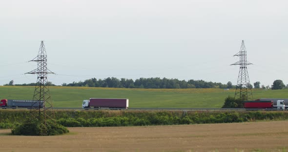 The Movement Of Trucks On The Highway Located In The Countryside