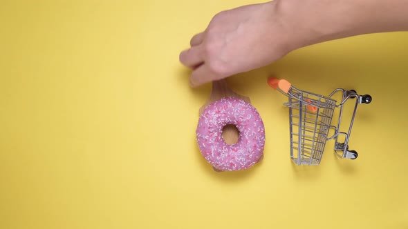 Donuts with Pink on a Yellow Background