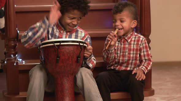 Two Afro Boys Play Music.