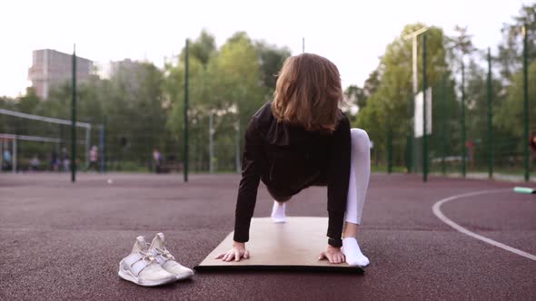 Motivated Fit Athletic Woman in Tight Pants p Summer Day