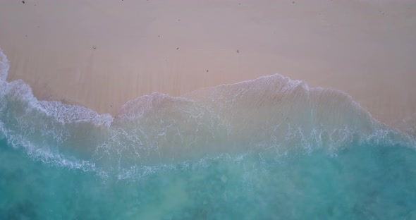 Wide fly over tourism shot of a summer white paradise sand beach and aqua turquoise water background