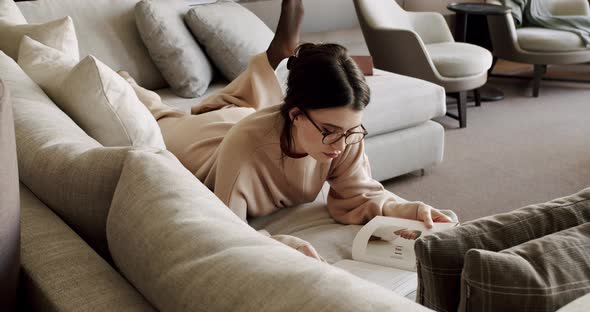 Attractive Lady Enjoying Spending Leisure Time with Read Modern Novel Literature