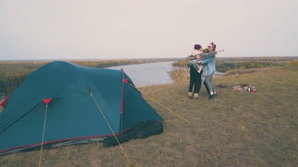 Girl Tourists Have Funny Party at Campsite on Green Hill