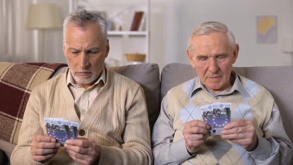 Unhappy Elderly Men Counting Euros, Low Social Payment, Poverty Problems