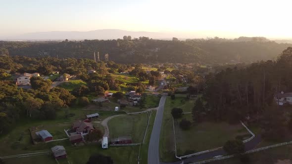 Small iconic USA town surrounded by green valley, aerial drone view