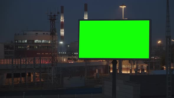 Large Billboard with a Green Screen on a Busy Highway