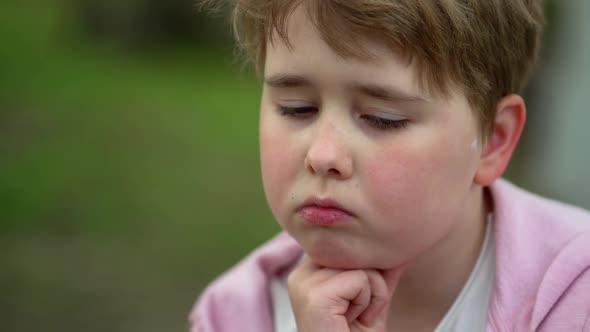 Close-up Portrait of a Sad Child Girl