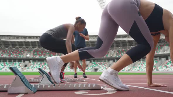 Woman Sprinters are Training at the Stadium Two Sporty Females are Competing in Shortdistance