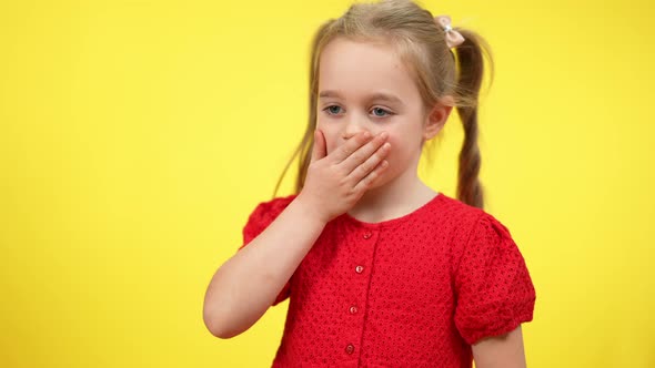 Middle Shot of Positive Cute Girl Sending Air Kisses at Yellow Background