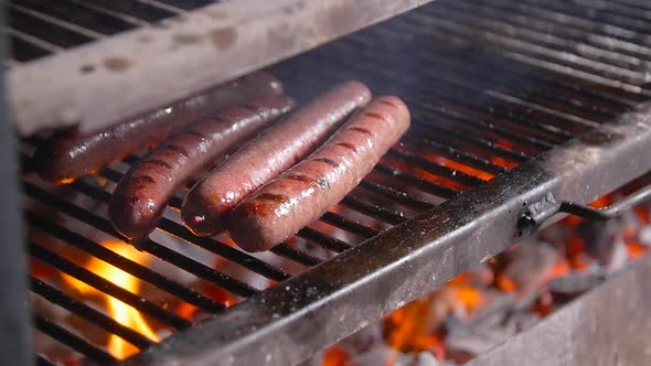 Cooking Concept. Barbecue Sausages Grilled on a Fire Grill