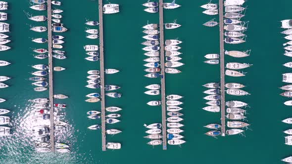 Bird eye view from drone of yachts and sailboats in the harbor marina.