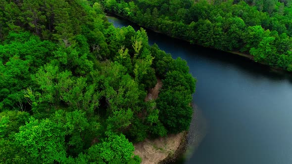 Aerial view of stunning forest and river in summer