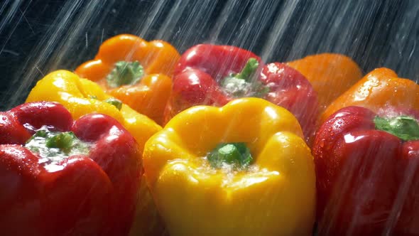 Bell Peppers Get Washed In Water Spray