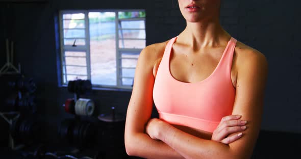 Portrait of woman in sportswear standing in gym