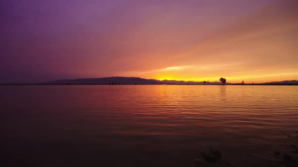 Water rippling on Utah Lake during colorful sunset