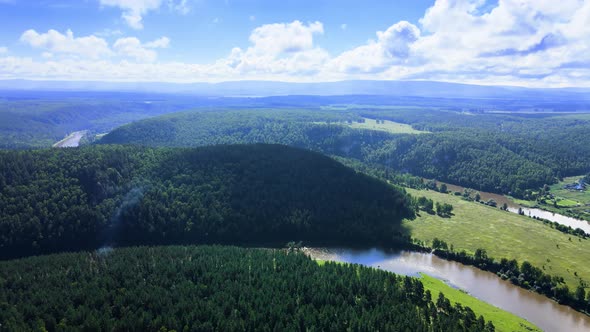 Panorama of a meandering river and forest at the foot of the Ural Mountains