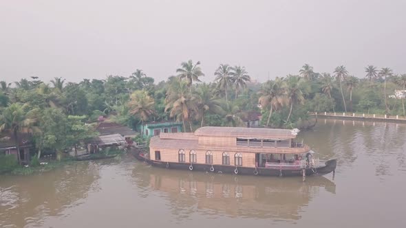Houseboat in Kerala backwaters at Alleppey, India. Aerial drone view