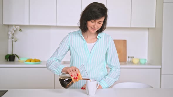 Cheerful Female Holding Pourover Coffee Maker