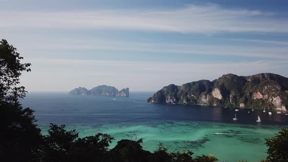 Phi Phi don island, shooting from a drone. Turquoise clear water. Yachts, boats floating. Water Grad