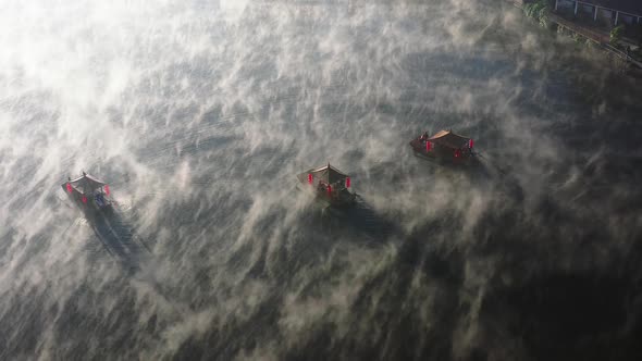 Aerial View of Sunrise with Fog Over Ban Rak Thai Chinese Village Near a Lake in Mae Hong Son