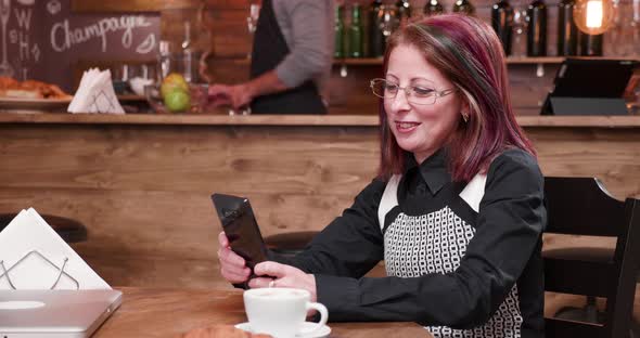 Video Call on Smartphone in Vintage and Styled Coffee Shop