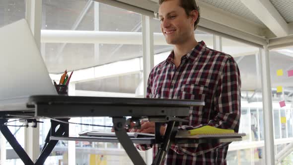 Young man working in a creative office