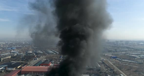 Smokestack Releasing Black Smoke into the Air