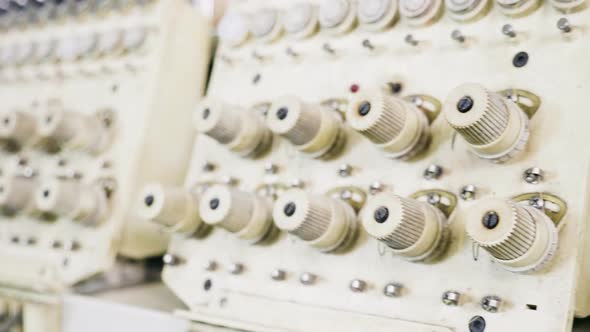 Dolly Shot of Industrial Sewing Machinery in a Fabric Factory